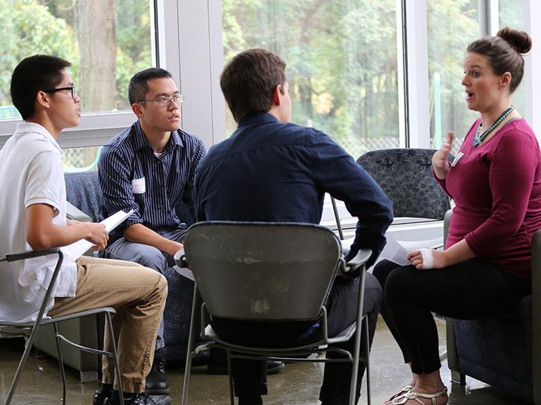 students networking with alumni